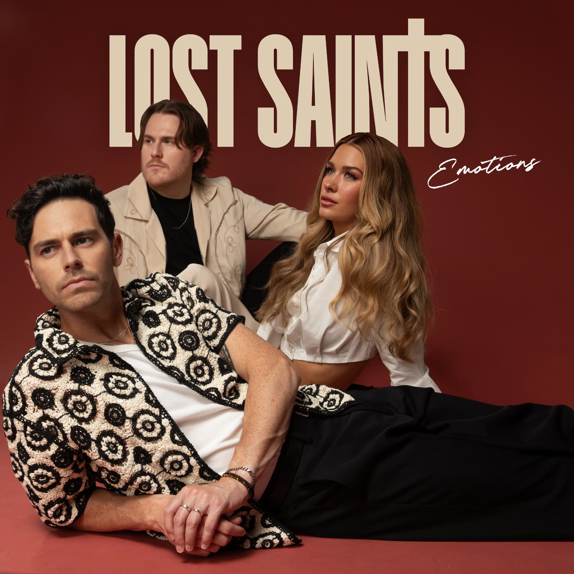 Lost Saints — Emotions EP cover: the band against a deep burgundy background beneath the Emotions script lettering